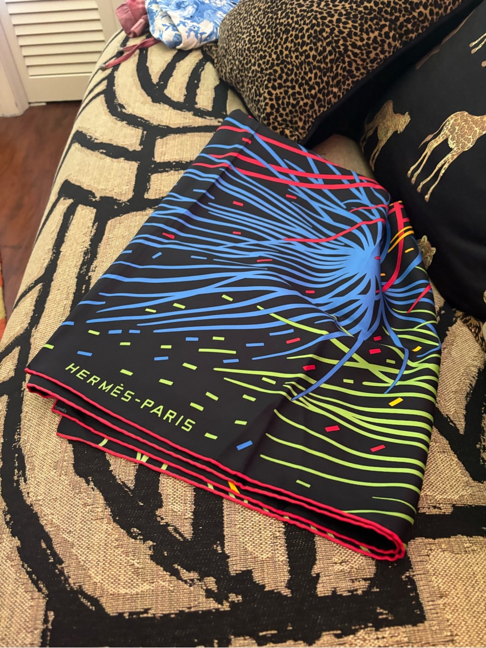 Women’s Hermes scarf with multi color firework design.